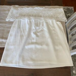 White off the shoulder blouse with lace detail.